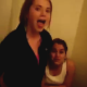 One girl pees, while her friend talks. She talks about how much she peed and how she tends to wipe herself.